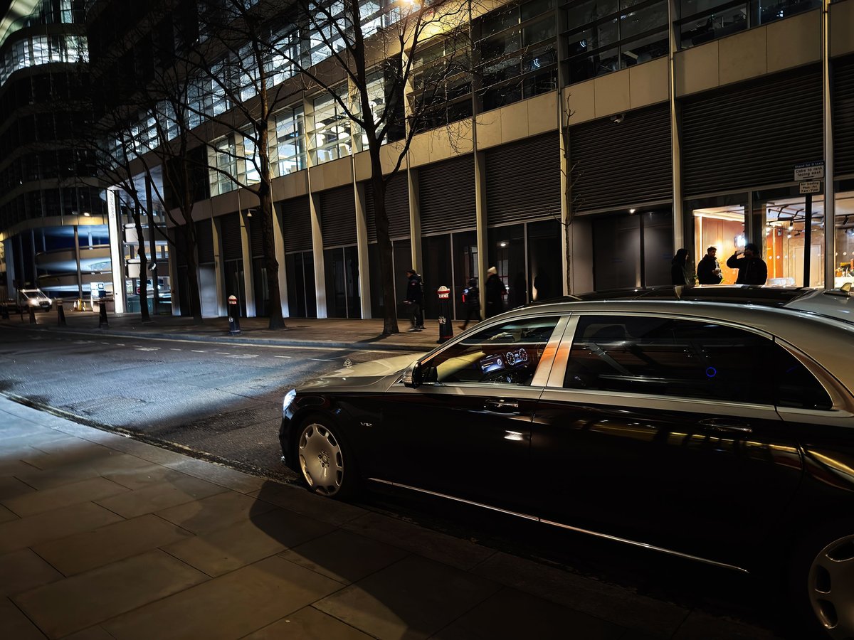 Private transfer vehicle waiting at night before pickup